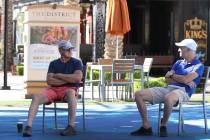 Tom Nolte, left, and Paul, who declined to give his last name, chat while social distancing at ...