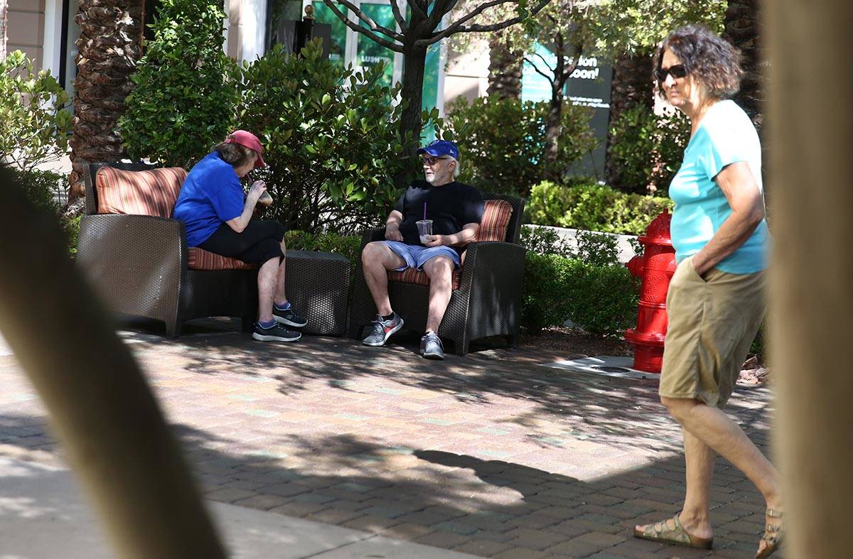 Suzi Banto and her husband Bobby, both of Henderson, relax at The District on Friday, May 1, 20 ...