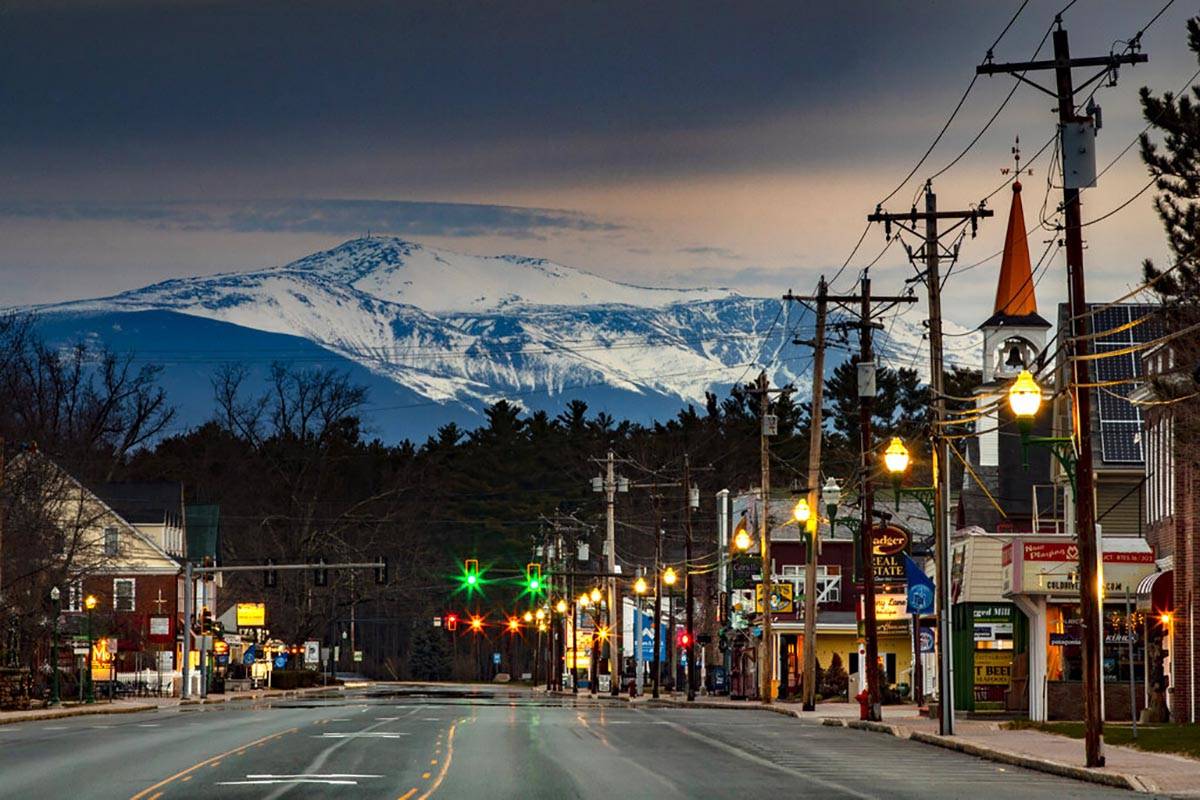 Mt. Washington looms in the distance over scenic North Conway, N.H., where most small shops and ...