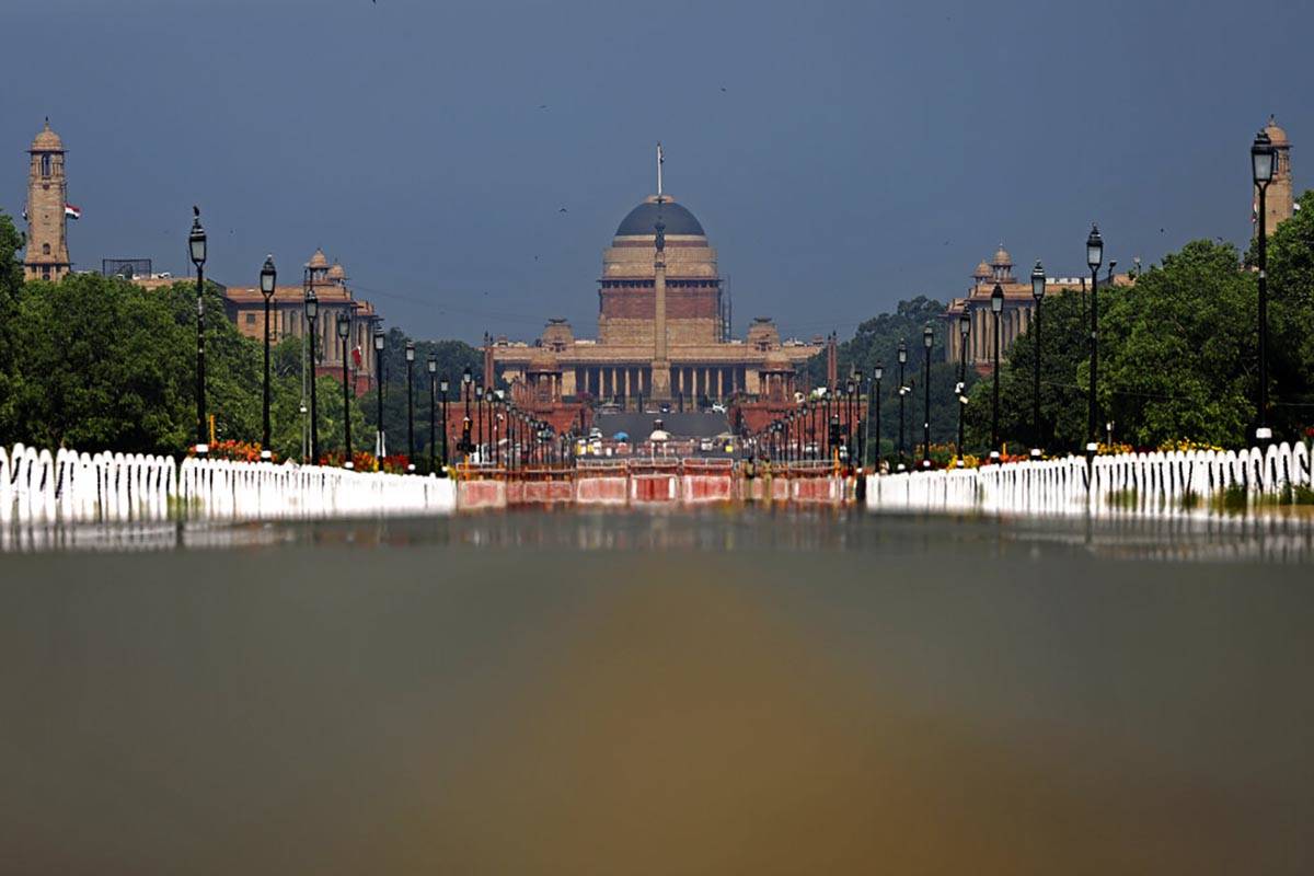 Rajpath, India's ceremonial boulevard is deserted, as India's Presidential Palace is seen durin ...