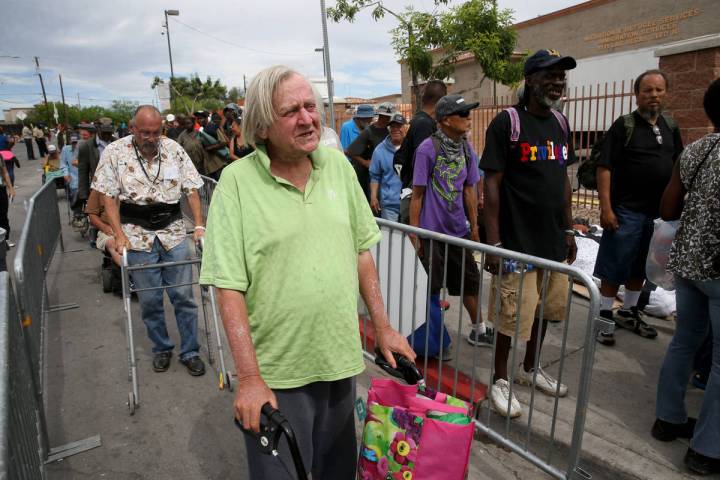 Robert Godleski, 73, lines up for a meal at Catholic Charities on Foremaster Lane between Las V ...