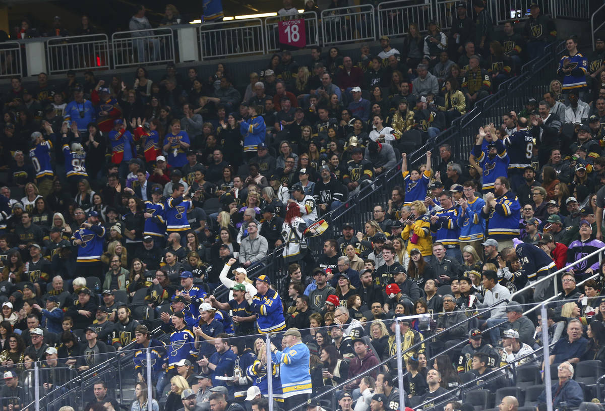 St. Louis Blues fans celebrate their team's first goal against the Golden Knights in the first ...