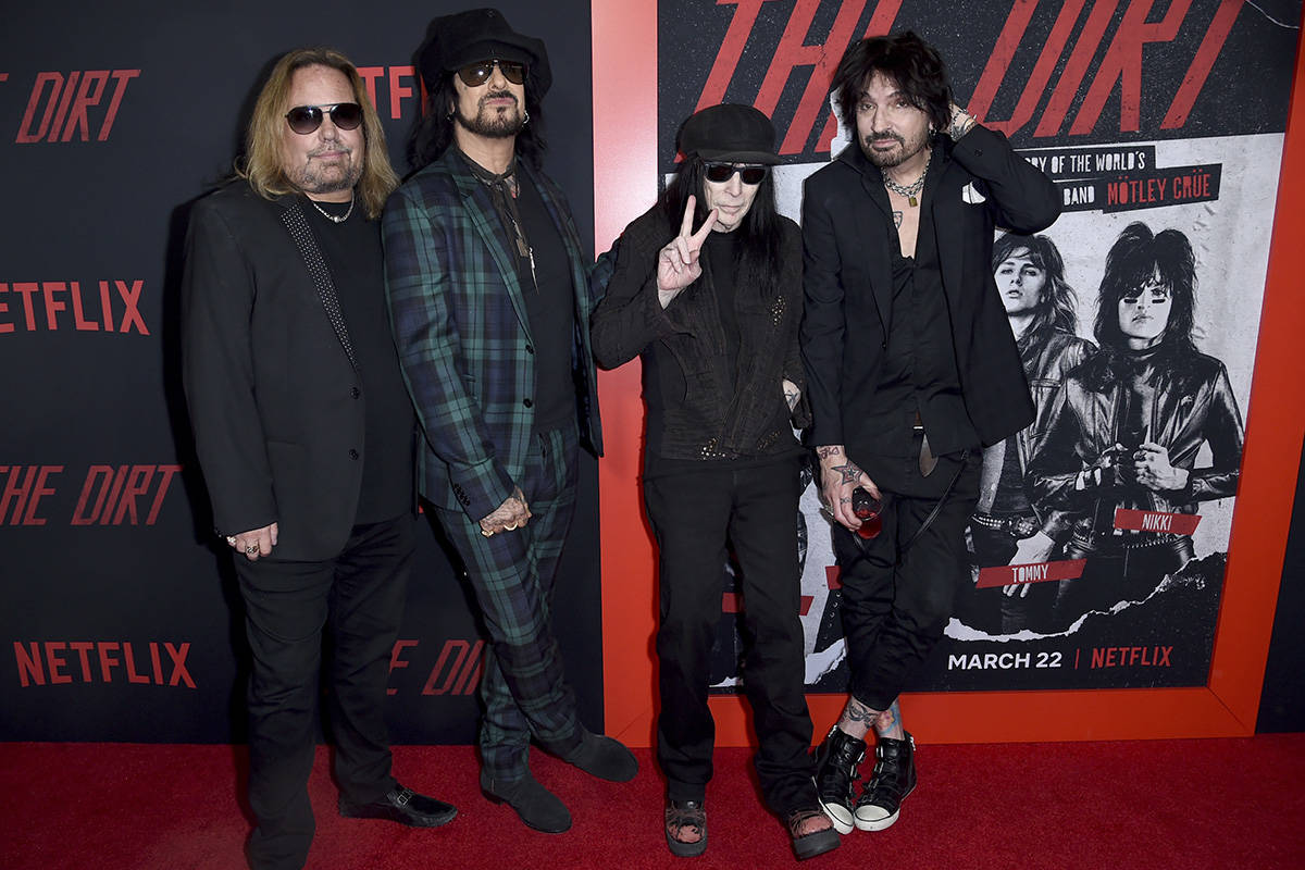 Vince Neil, from left, Nikki Sixx, Mick Mars and Tommy Lee, of Motley Crue, arrive at the world ...