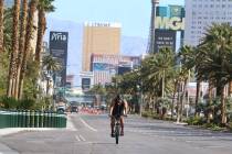 A man rides his bike along Las Vegas Boulevard South during a sunny Tuesday, April 14, 2020, in ...
