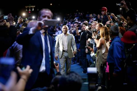 Boxer Floyd Mayweather Jr. arrives for a news conference, Wednesday, March 11, 2015, in Los Ang ...