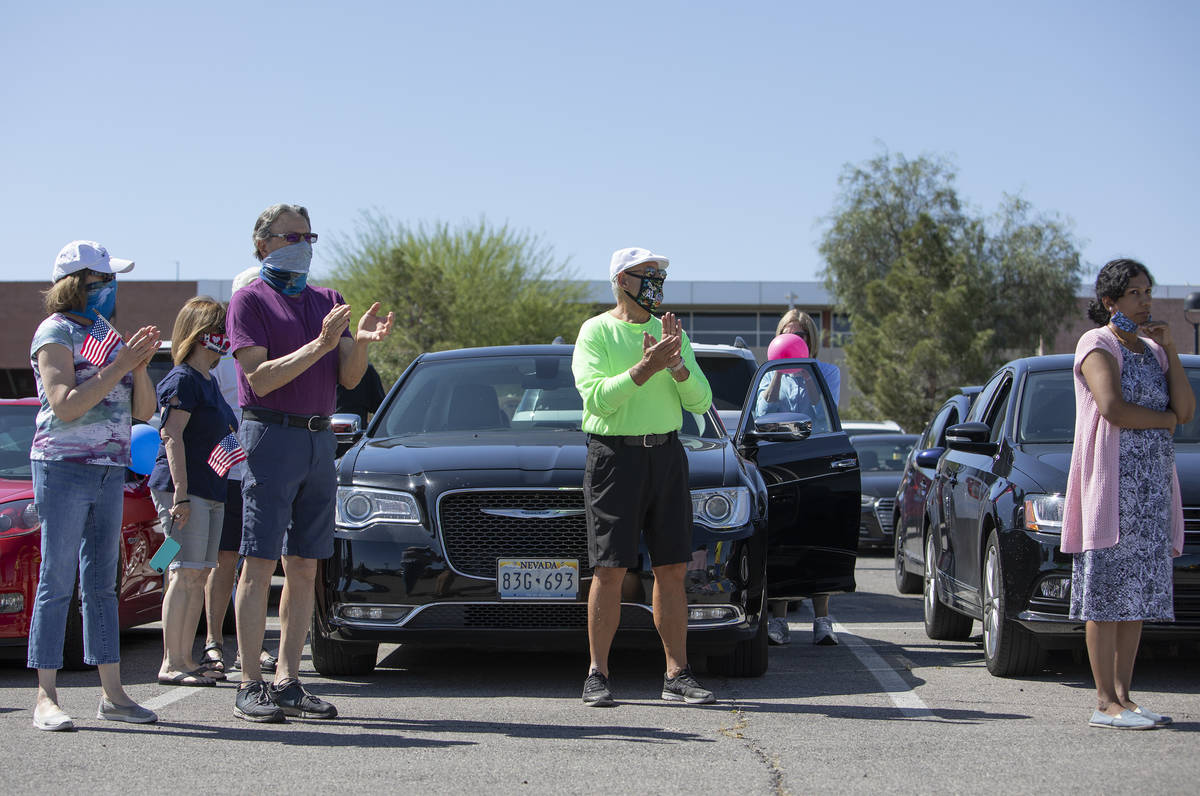 People protesting the building of the new hockey arena in Henderson cheer before getting in the ...