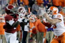 Alabama's Jerry Jeudy catches a touchdown pass in front of Clemson's Tanner Muse during the fir ...