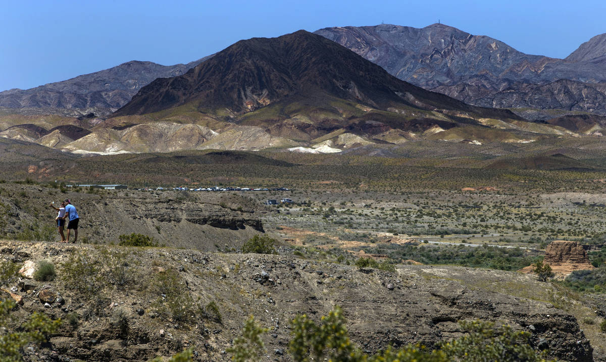 A couple takes a photo at the 33 Hole Scenic Overlook in the Lake Mead National Recreation Area ...