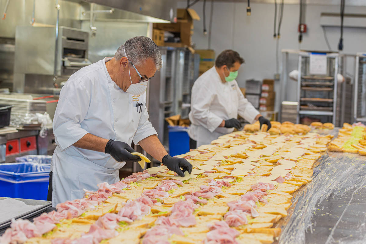 Sandwich assembly line as The Venetian's culinary team prepares thousands of boxed meals for Ca ...