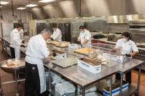 The Venetian's Culinary Team wraps sandwiches for the meal donation to Catholic Charities of So ...
