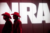 FILE - In this May 4, 2013, file photo, National Rifle Association members listen to speakers d ...