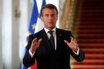 French President Emmanuel Macron speaks after a video-conference summit on vaccination at the E ...