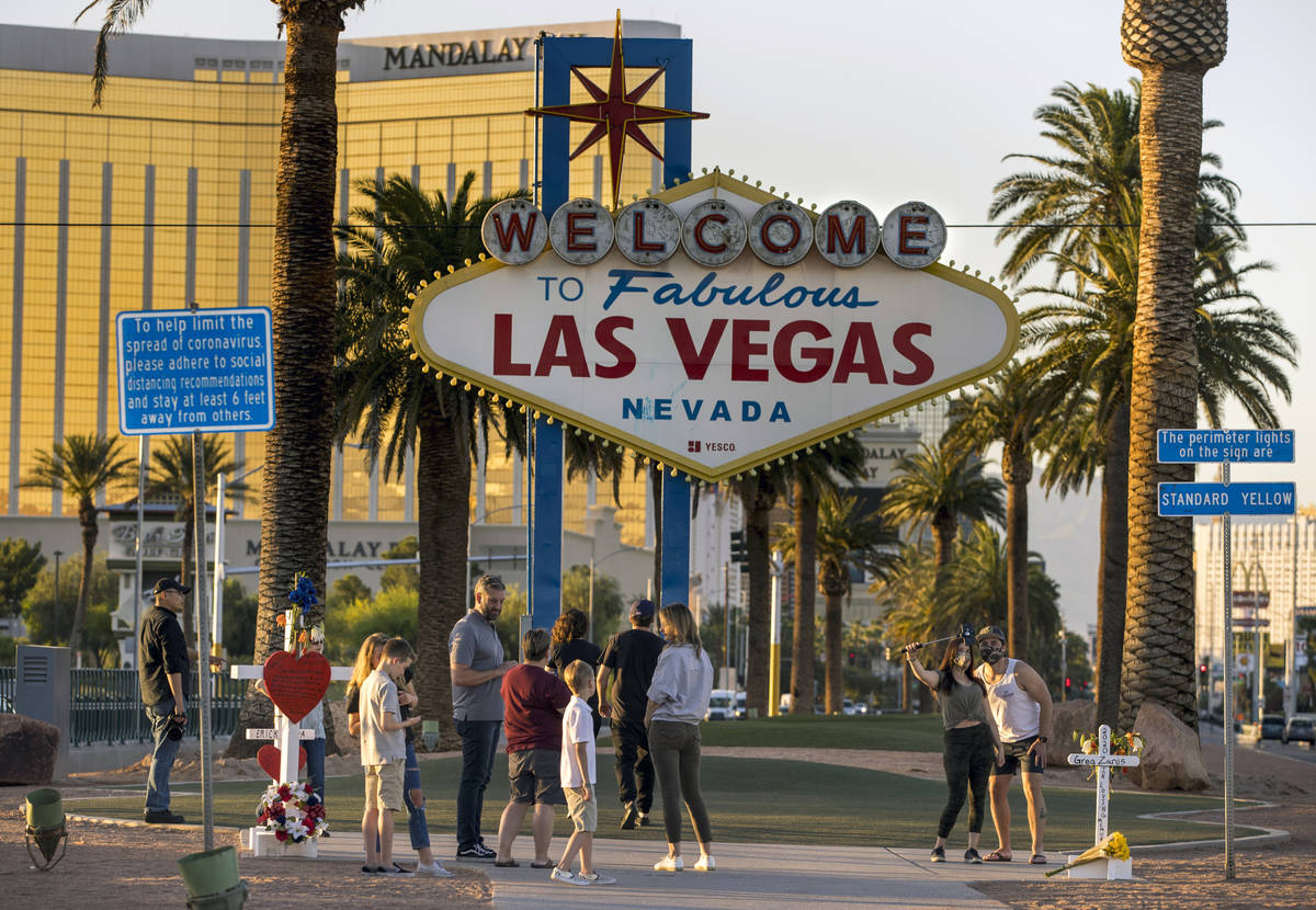 White crosses for Greg Zanis at the "Welcome to Fabulous Las Vegas" sign on Monday, M ...