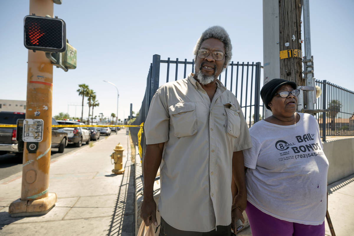 Residents of Sterling Gardens Dwayne Quiney, left and Sheron Clark, wait to go back into their ...