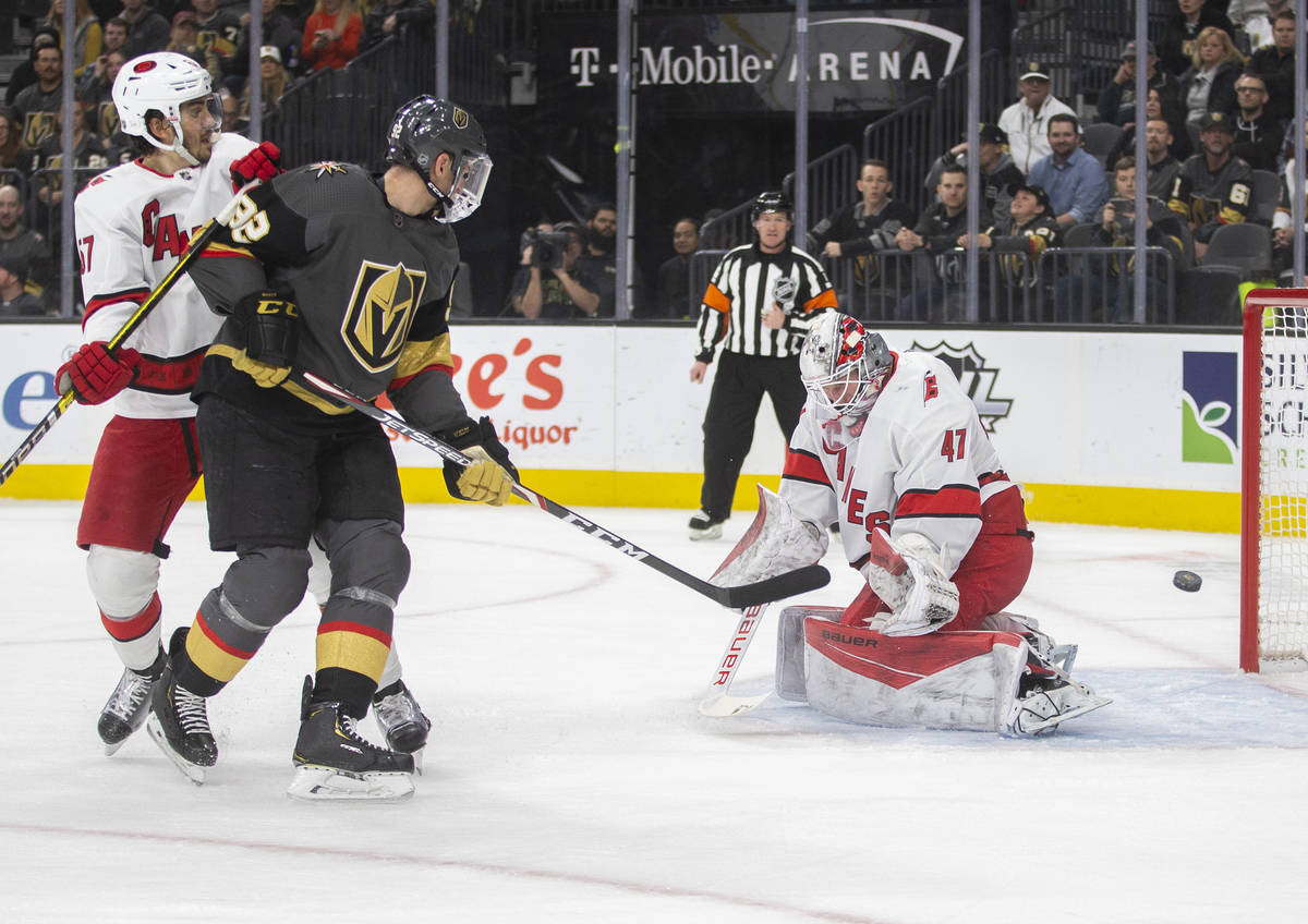 Vegas Golden Knights left wing Tomas Nosek (92) shoots on Carolina Hurricanes goaltender James ...