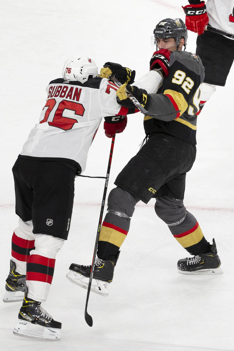 New Jersey Devils defenseman P.K. Subban (76) gets tied up with Vegas Golden Knights left wing ...