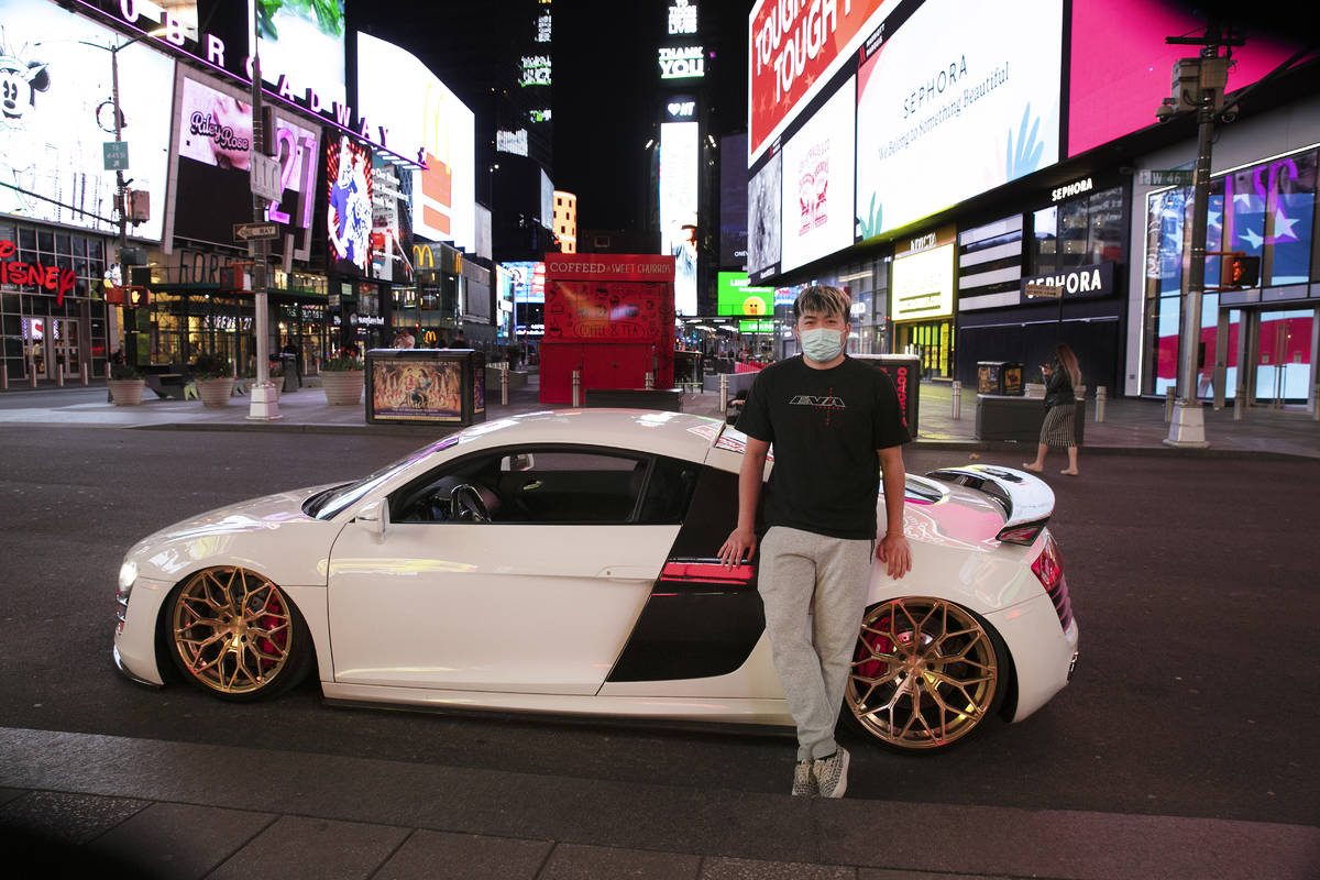 In this Saturday, May 2, 2020 photo, Danny Lin poses for photos with his 2008 Audi R8 in New Yo ...