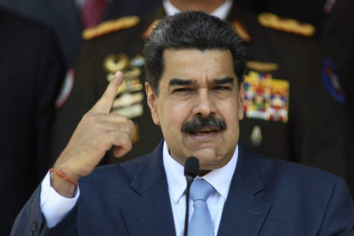 FILE - In this March 12, 2020 file photo, Venezuelan President Nicolas Maduro givesa press conf ...