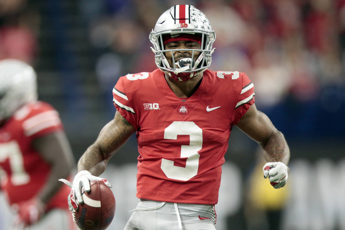 In this Dec. 1, 2018, file photo, Ohio State cornerback Damon Arnette (3) celebrates after an i ...