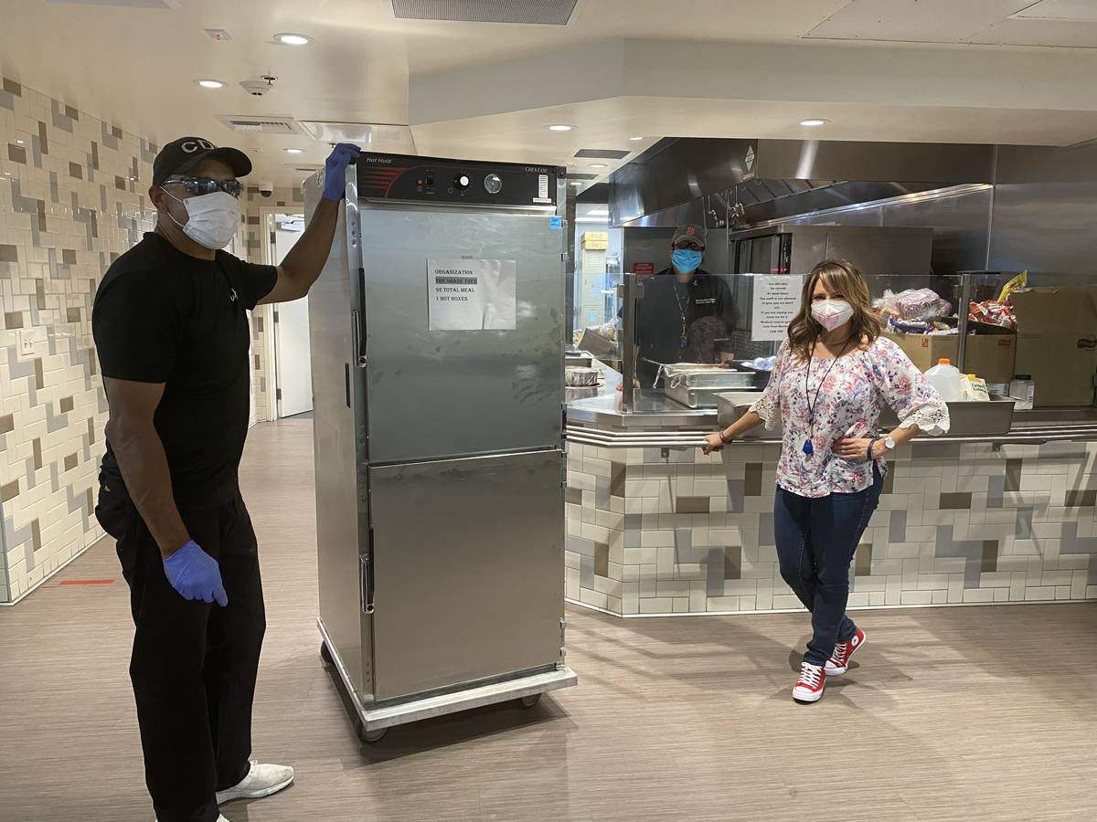 The Shade Tree CEO Linda Perez with a member of the Wynn Las Vegas team in TST kitchen. (Faiss ...