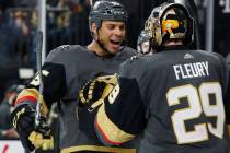 Vegas Golden Knights' Ryan Reaves, left, celebrates with goaltender Marc-Andre Fleury after def ...