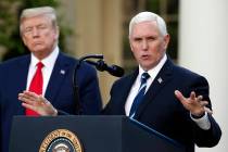 President Donald Trump listens as Vice President Mike Pence speaks about the coronavirus in the ...