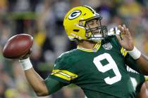 Green Bay Packers' DeShone Kizer throws during the first half of an NFL football game against t ...