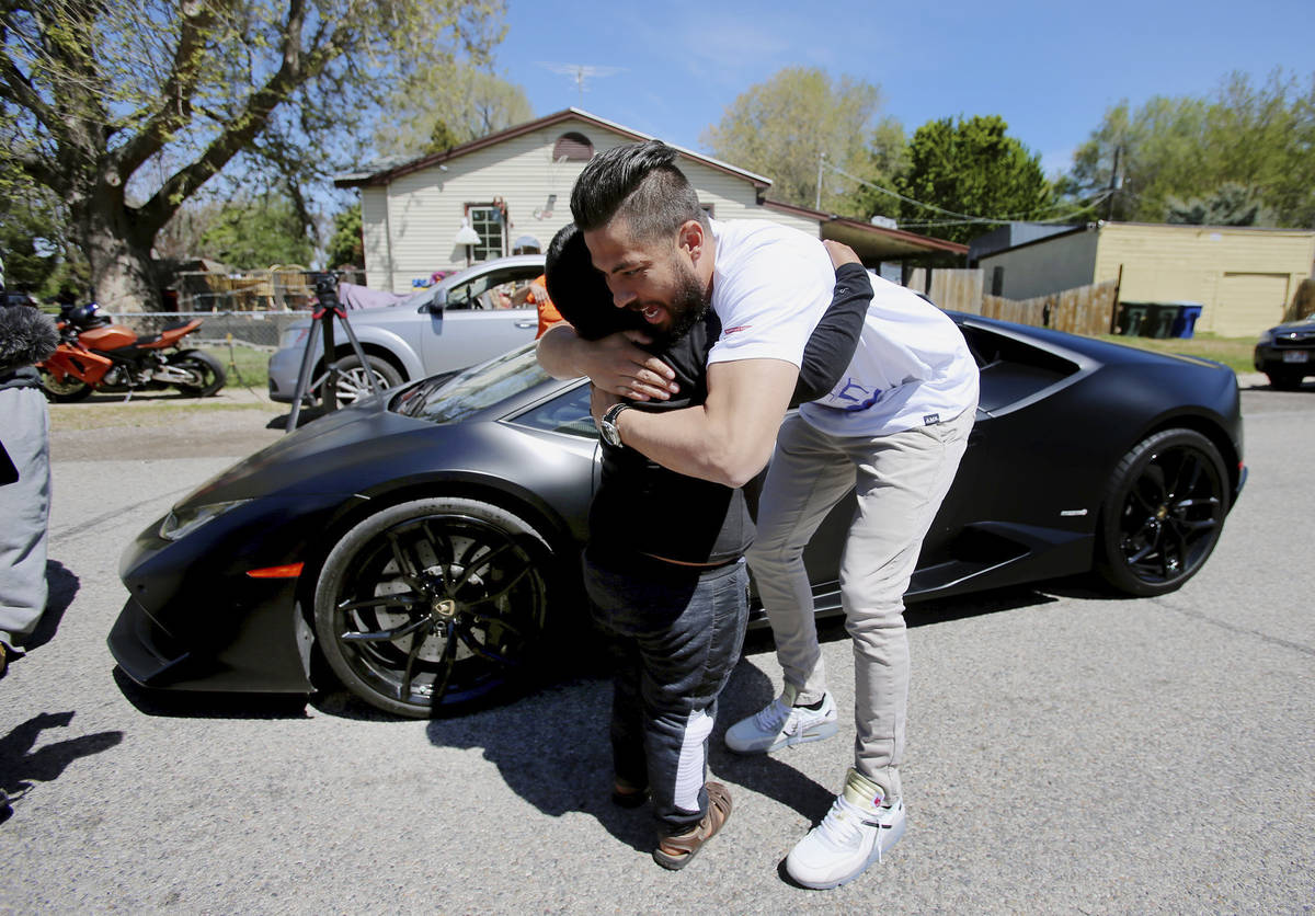 Adrian Zamarripa hugs Jeremy Neves after Adrian and his mother, Beatriz Flores, went for a ride ...