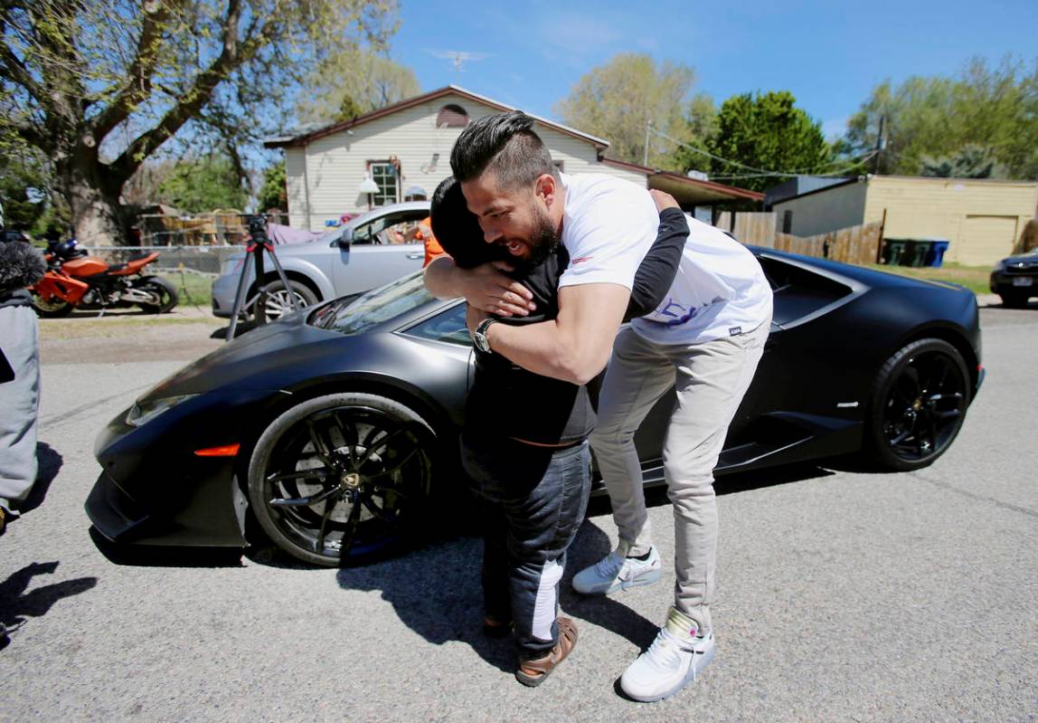 Adrian Zamarripa hugs Jeremy Neves after Adrian and his mother, Beatriz Flores, went for a ride ...