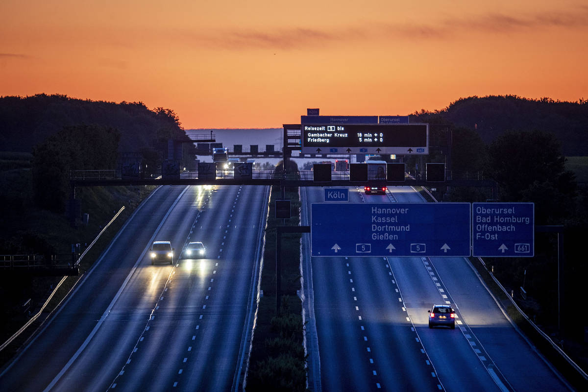 Cars and trucks are driven on a relatively empty highway in Frankfurt, Germany, Wednesday, May ...