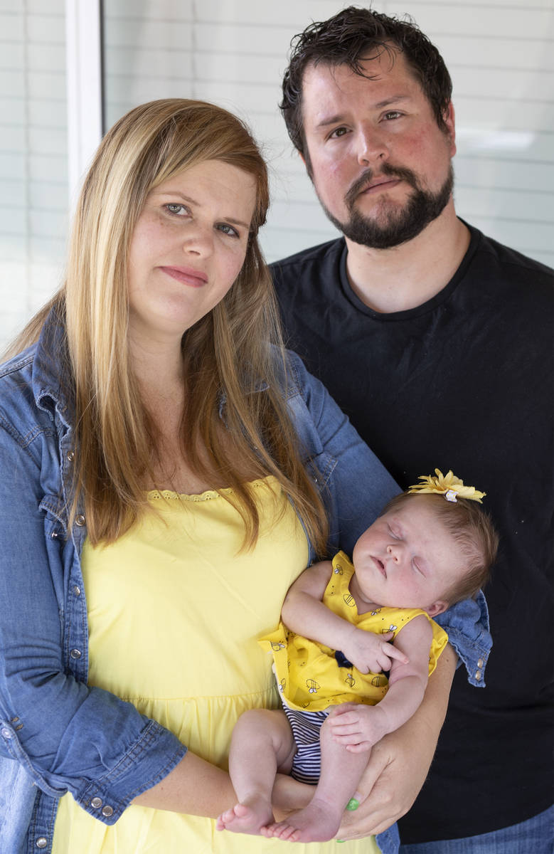 Christie Jensen, her boyfriend Jesse Zavala and their 1-month-old baby Eliana Zavala pose for a ...