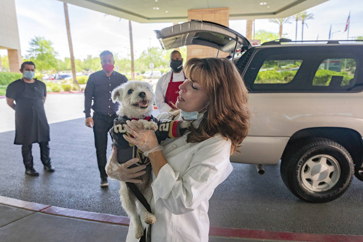 Owner of Louisiana kitchen Lola’s, Lola Pokorny, holds Bark-Andre Furry at Summerli ...