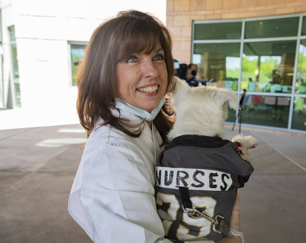 Owner of Louisiana kitchen Lola’s, Lola Pokorny, holds Bark-Andre Furry at Summerli ...