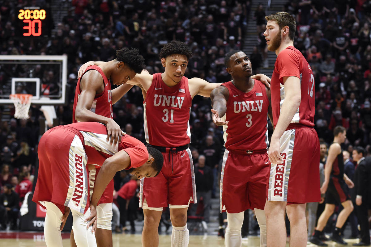 UNLV players huddle before an NCAA college basketball game against San Diego State Saturday, Fe ...