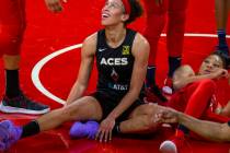 Las Vegas Aces forward Dearica Hamby (5, left) laughs during the first half of the WNBA playoff ...