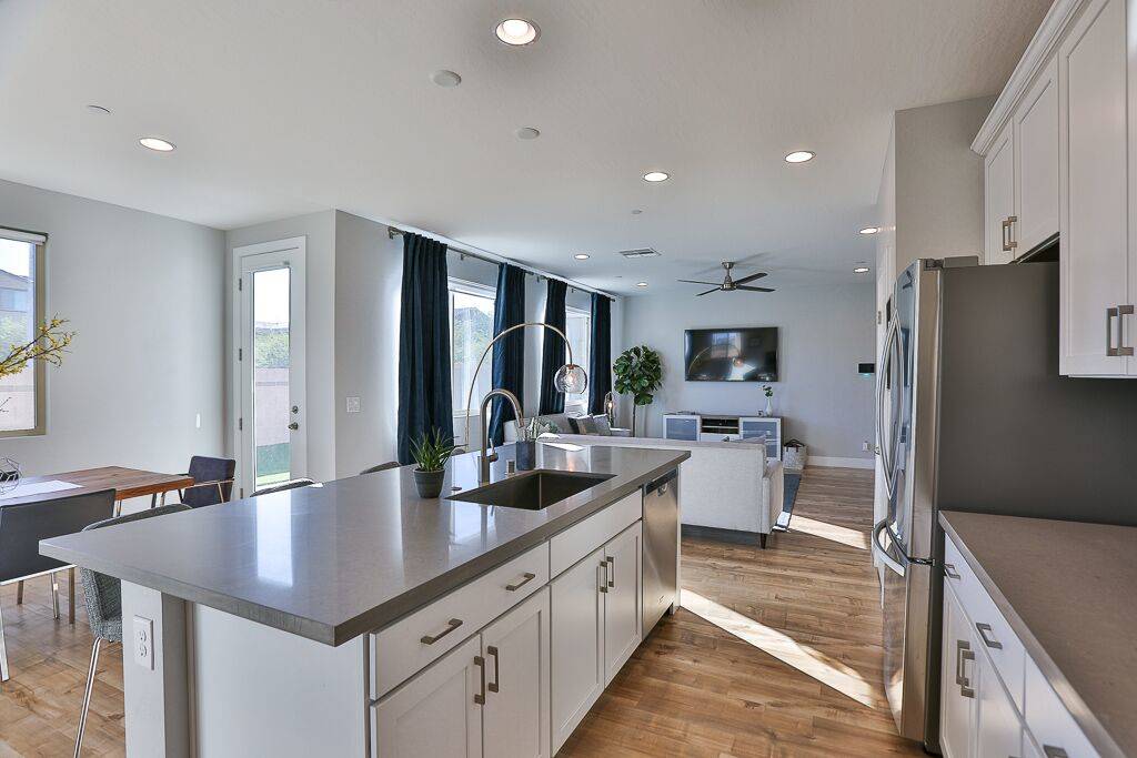 The Inspirada home features a kitchen with 42-inch raised panel cabinets and quartz countertops ...