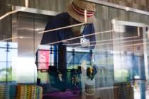 Custodian Jarrell Siler sanitizes tables and chairs in the Hospitality Hall at UNLV in Las Vega ...