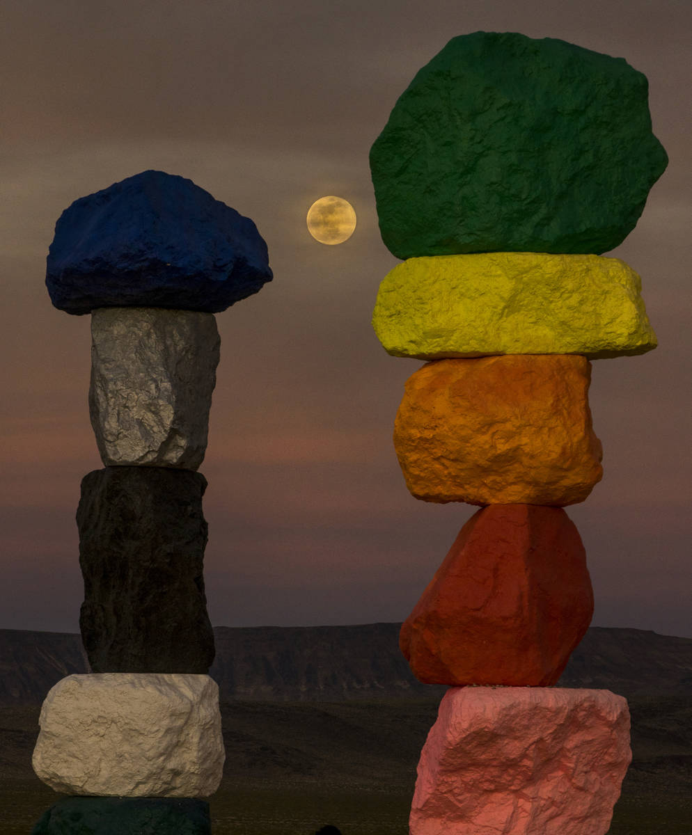 The moon rises over the Seven Magic Mountains outside Las Vegas on May 6, 2020.  The full ...