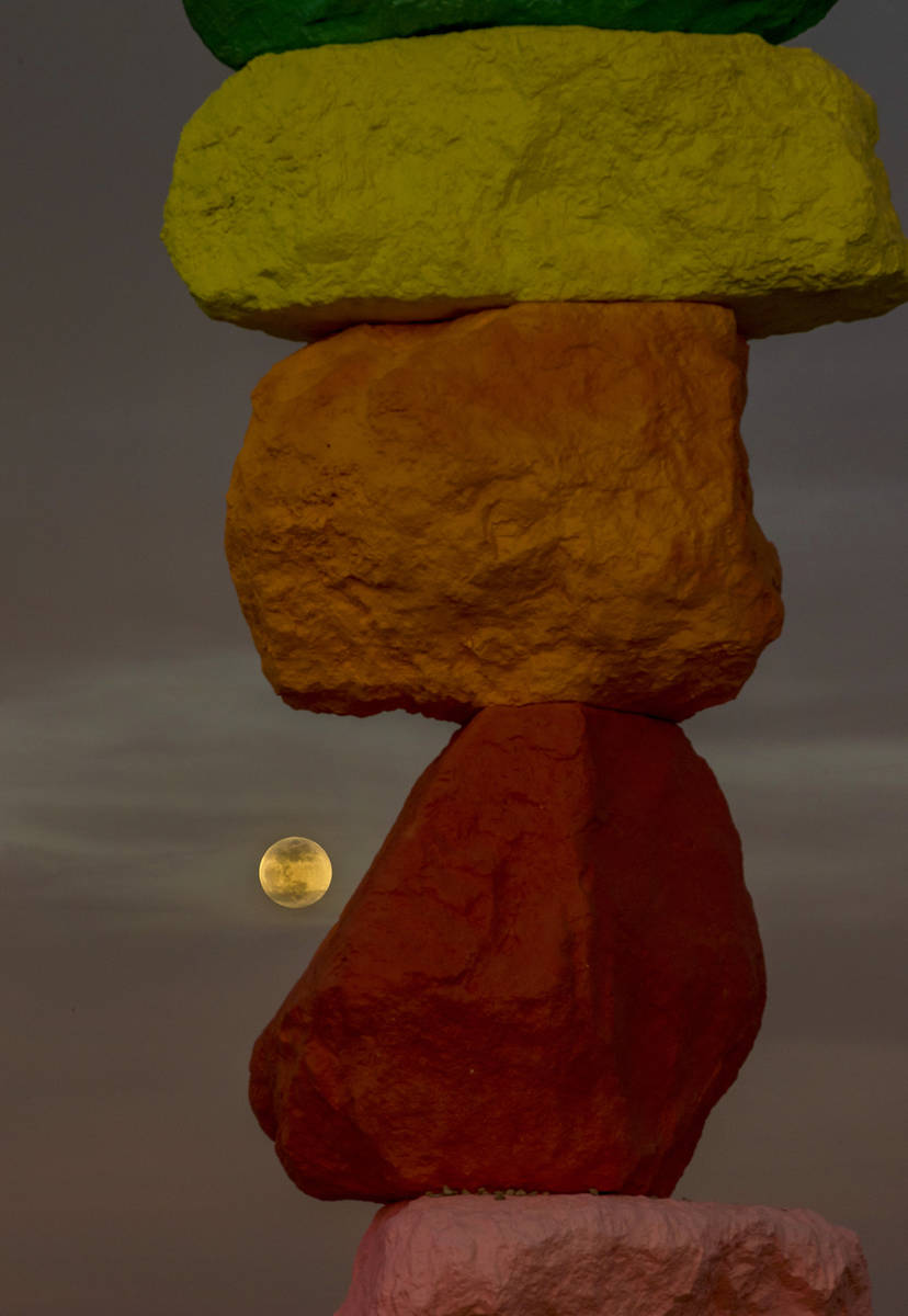 The moon rises over the Seven Magic Mountains outside Las Vegas on May 6, 2020. The full moon ...