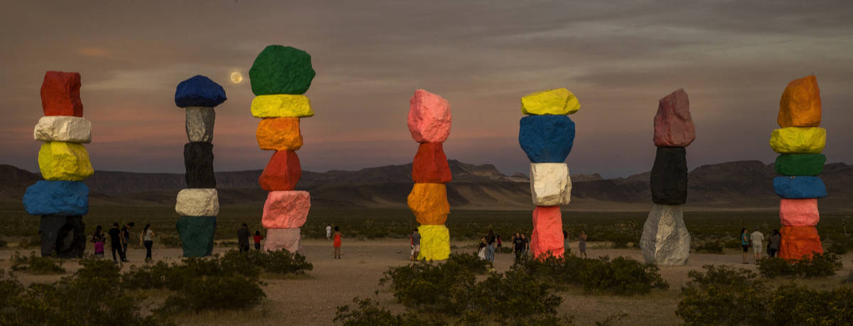 The moon rises over the Seven Magic Mountains outside Las Vegas on May 6, 2020.  The full moon ...