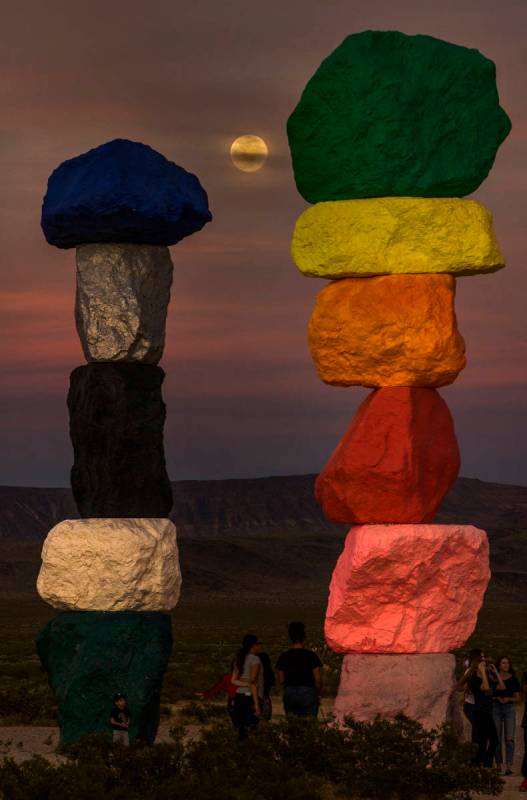 The moon rises over the Seven Magic Mountains outside Las Vegas on May 6, 2020.  The full moon ...