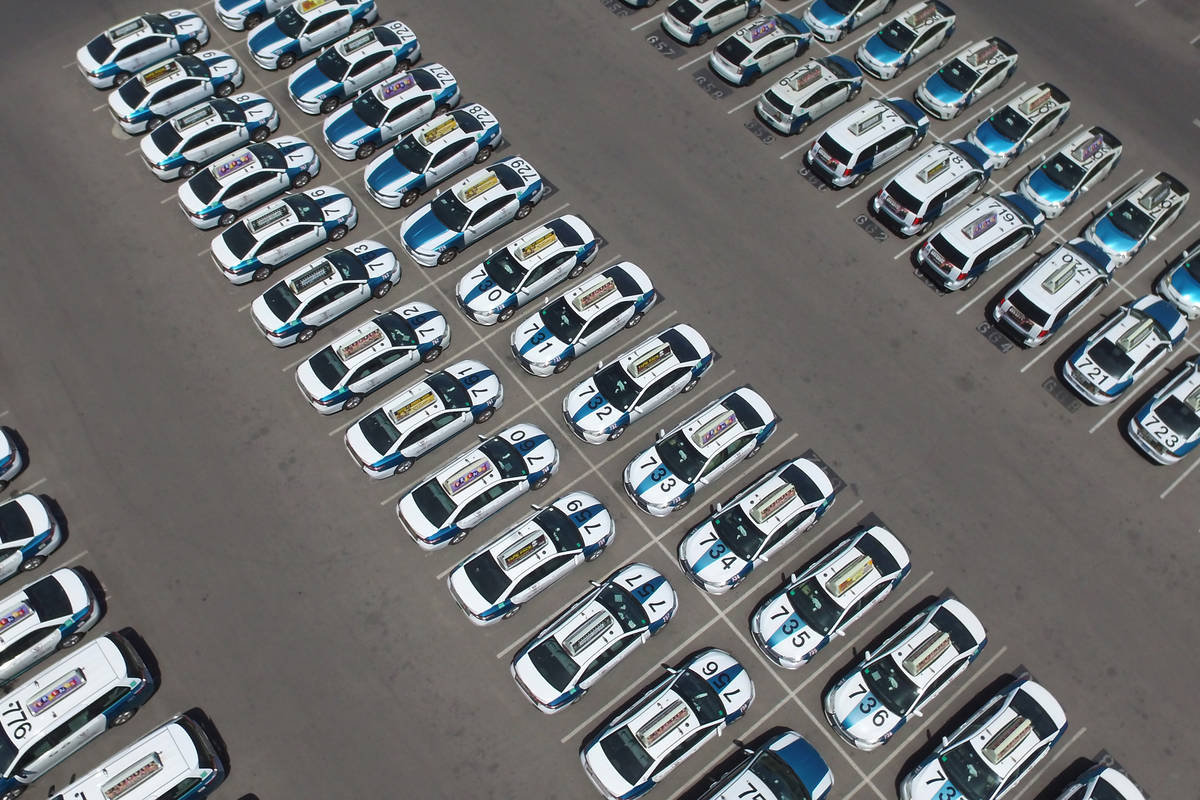 Taxis sit in a parking lot of Nellis Cab Company on Thursday, May 7, 2020, in Las Vegas. Taxi r ...