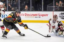 Vegas Golden Knights right wing Reilly Smith (19) sends a shot attempt on Arizona Coyotes goalt ...