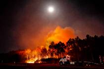 In this Wednesday evening, May 6, 2020 photo, a Florida forestry tractor trailer is parked in W ...