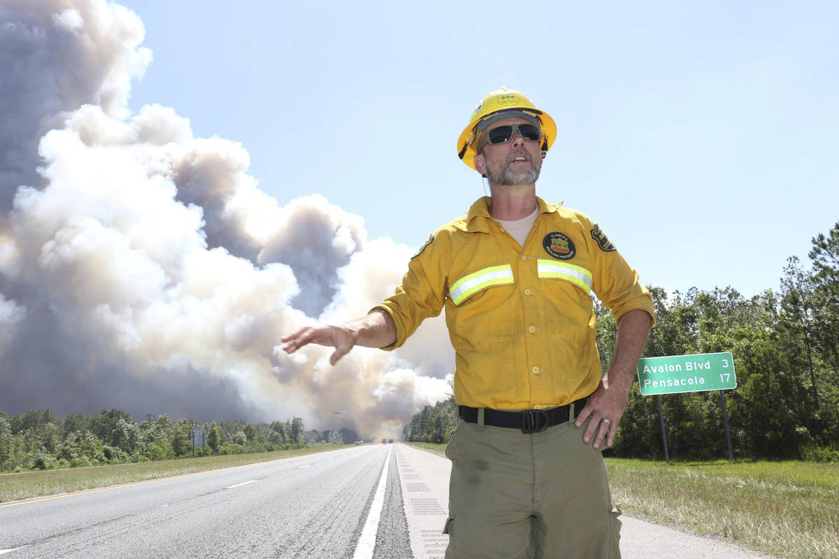 In this Wednesday, May 6, 2020 photo, Joe Zwierzchowski, spokesman with the Florida Forest Serv ...