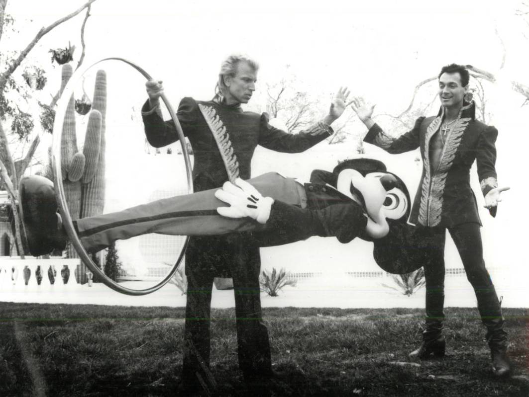 Siegfried and Roy perform a magic trick with Mickey Mouse. (Review-Journal file)
