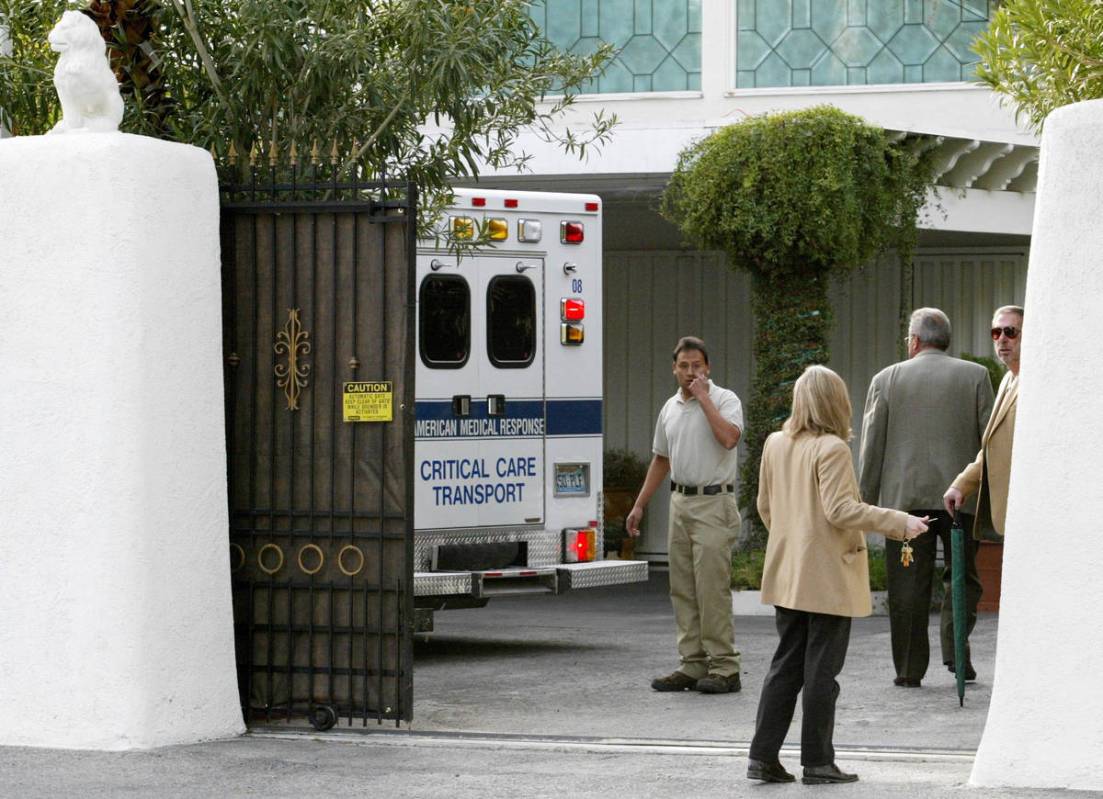 A private security detail escorts an ambulance transporting Roy Horn into the Siegfried and Roy ...