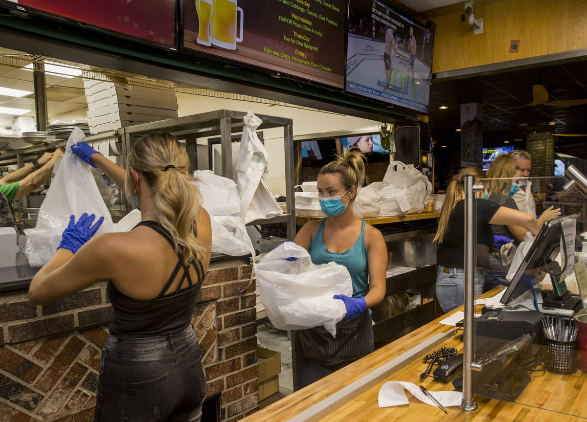 The front counter at Johnny Mac's Sports Bar & Grill has stayed busy but picking up more as ...