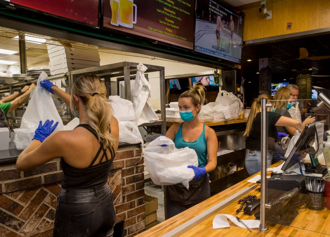 The front counter at Johnny Mac's Sports Bar & Grill has stayed busy but picking up more as ...
