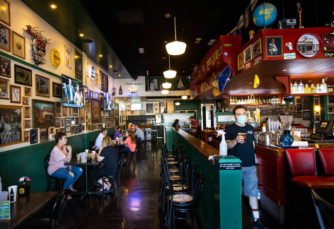 People dine at Hussong’s Cantina in Boca Park as some restaurants open